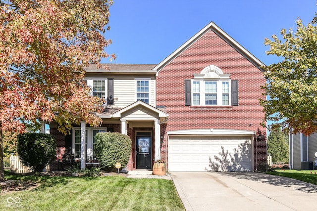 view of front of house with a front lawn and a garage