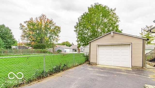 garage with a yard