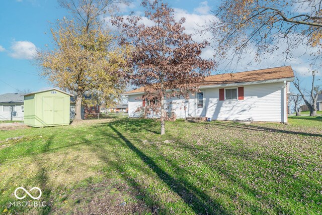 exterior space with a yard and a storage shed