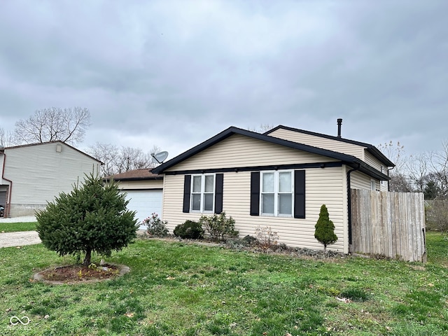 view of property exterior featuring a lawn and a garage