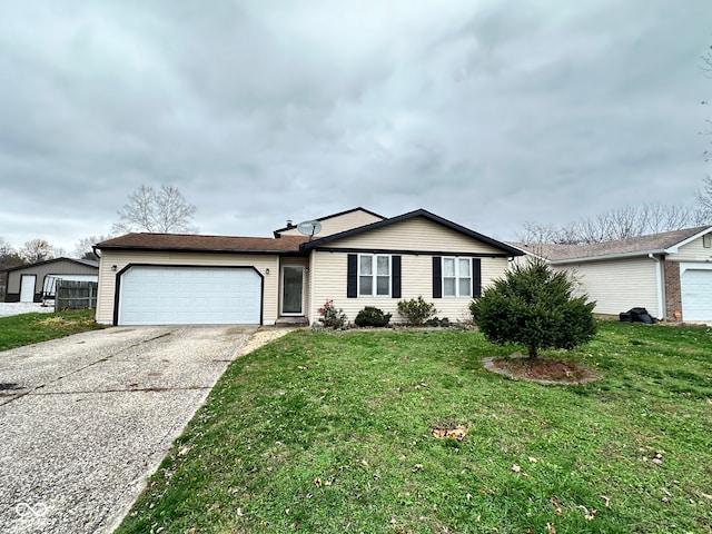 ranch-style house with a garage and a front lawn