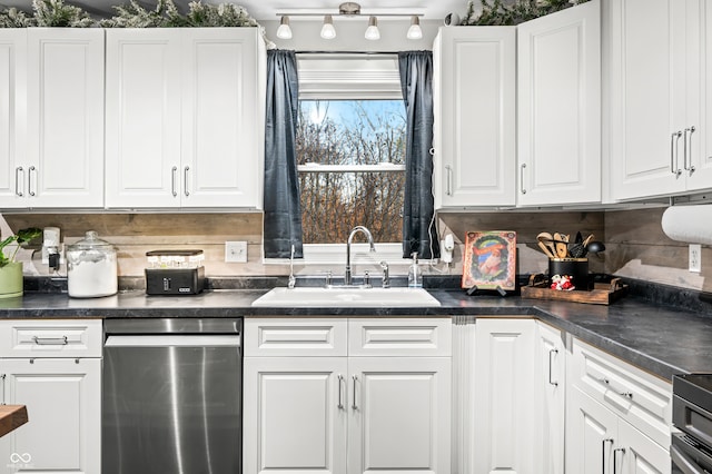 kitchen featuring white cabinets, decorative backsplash, sink, and stainless steel appliances