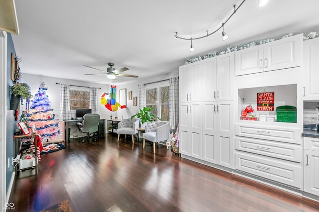 kitchen featuring white cabinetry, ceiling fan, and dark wood-type flooring