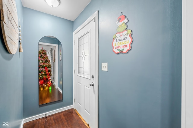 doorway to outside with dark wood-type flooring