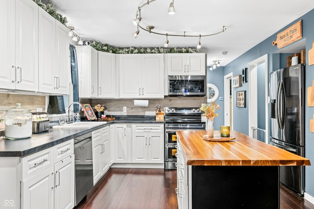 kitchen featuring a center island, dark wood-type flooring, sink, white cabinetry, and stainless steel appliances