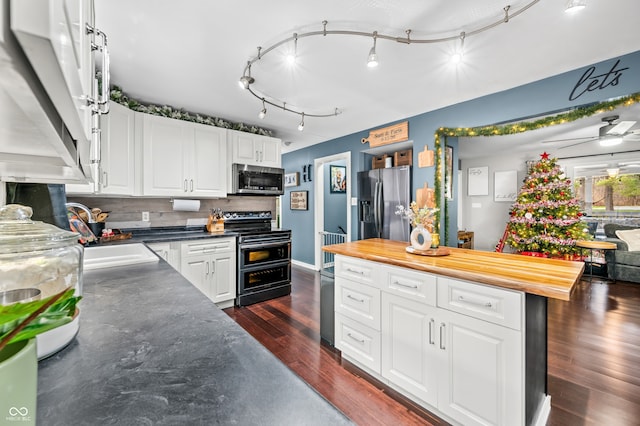 kitchen featuring white cabinetry, ceiling fan, stainless steel appliances, dark hardwood / wood-style floors, and backsplash