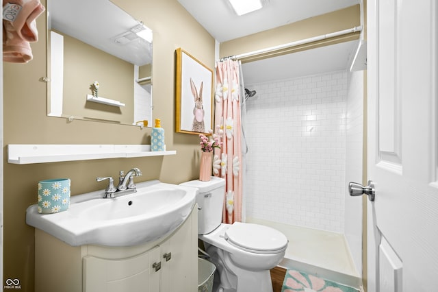 bathroom featuring a shower with curtain, vanity, and toilet