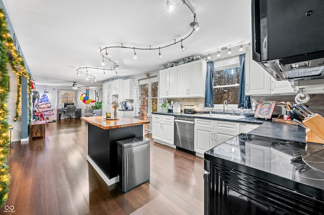 kitchen with dishwasher, ceiling fan, dark hardwood / wood-style floors, white cabinetry, and butcher block counters