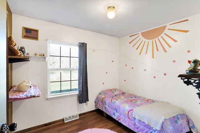 bedroom featuring dark hardwood / wood-style flooring