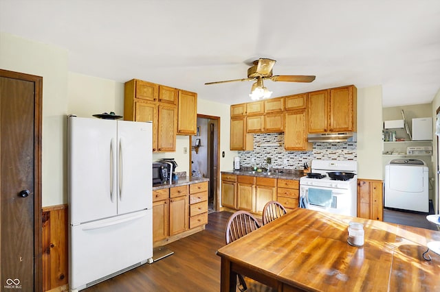 kitchen with decorative backsplash, dark hardwood / wood-style flooring, white appliances, ceiling fan, and washer / clothes dryer