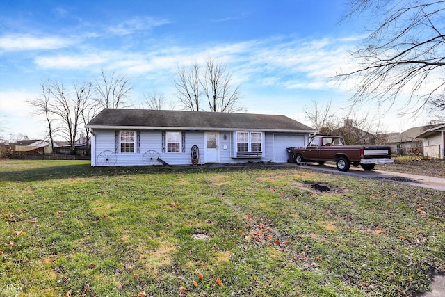 ranch-style house with a garage and a front yard