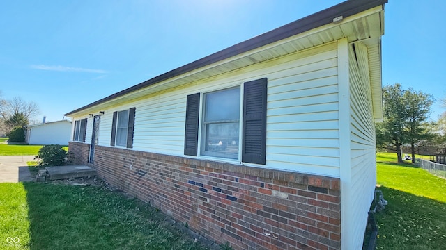 view of side of property featuring a yard