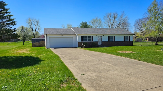 single story home with a front yard and a garage