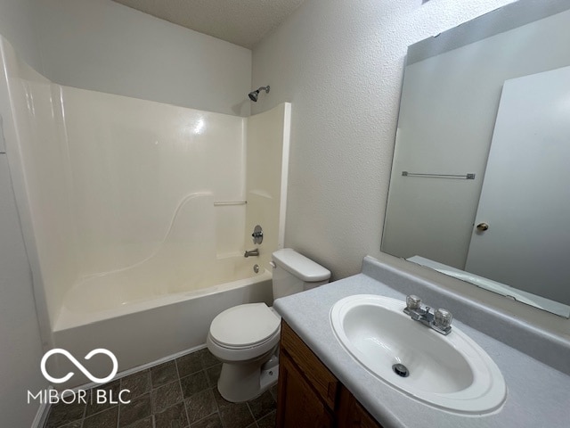 full bathroom with vanity, shower / bathtub combination, and toilet