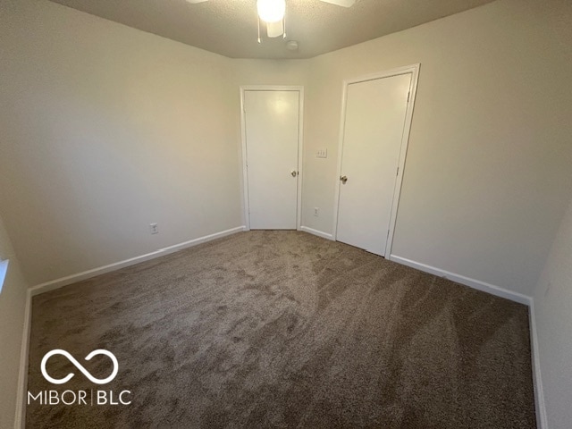 unfurnished bedroom with carpet and ceiling fan