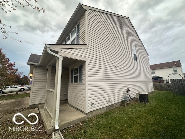 view of property exterior featuring a yard and cooling unit