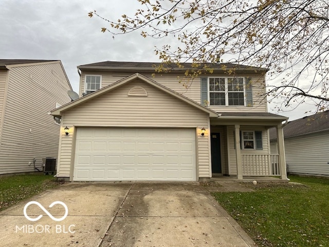 front of property featuring covered porch, a garage, and cooling unit