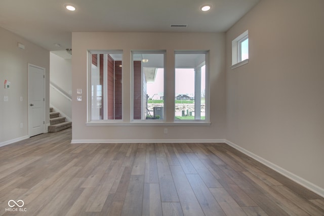 unfurnished room featuring light wood-type flooring