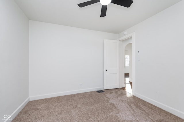 carpeted empty room with ceiling fan