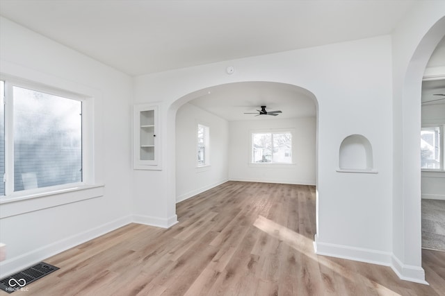 spare room with ceiling fan and light hardwood / wood-style floors