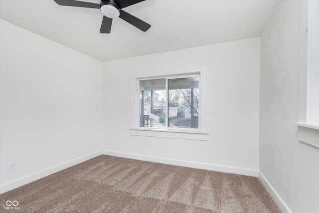 unfurnished room with ceiling fan and carpet floors