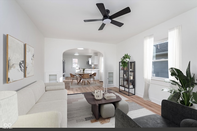 living room featuring hardwood / wood-style floors and ceiling fan