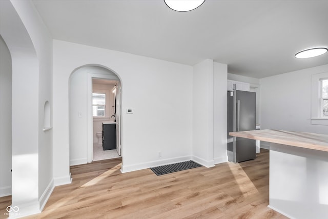 interior space featuring a healthy amount of sunlight and light hardwood / wood-style flooring