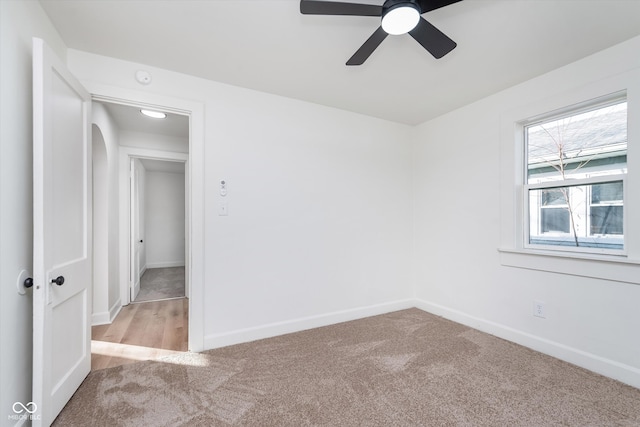 empty room featuring carpet and ceiling fan