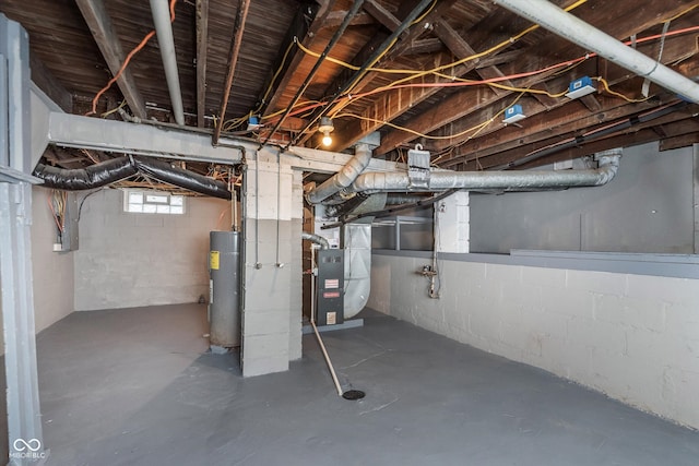 basement featuring heating unit and water heater