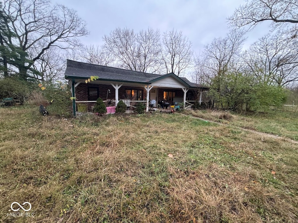 single story home featuring covered porch