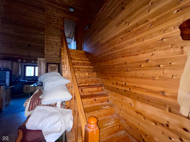 staircase with wooden walls