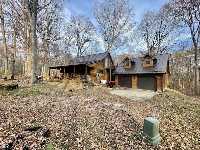227 Victory Hl, Coatesville, IN 46121 - view of front of house featuring a porch, a chimney, a metal roof, and an outdoor structure