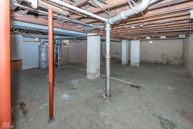 basement featuring heating unit and gas water heater