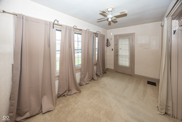 interior space featuring ceiling fan