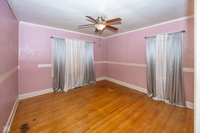 spare room featuring ceiling fan, ornamental molding, and hardwood / wood-style flooring