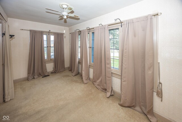 1330 N Bosart Ave, Indianapolis, IN 46201 - empty room with a ceiling fan, light carpet, and baseboards
