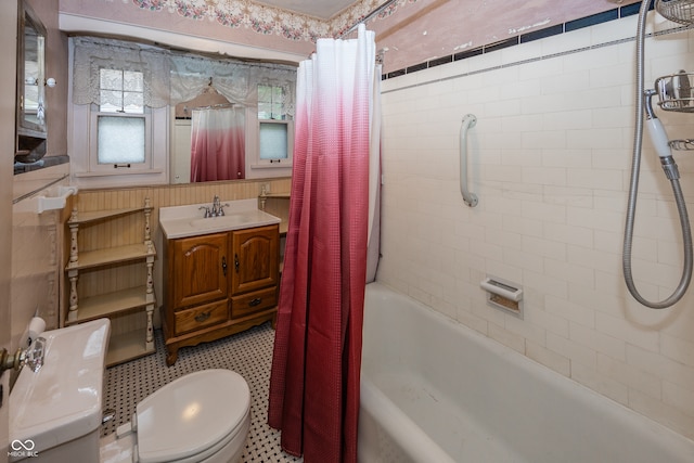 full bathroom featuring tile patterned flooring, vanity, toilet, and shower / bathtub combination with curtain