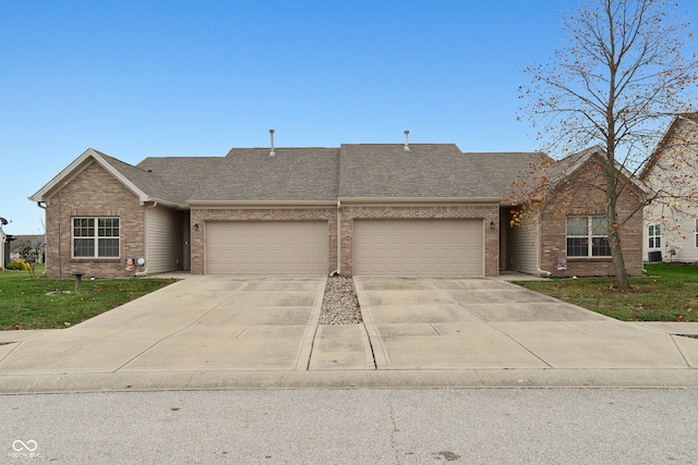 ranch-style home featuring a garage