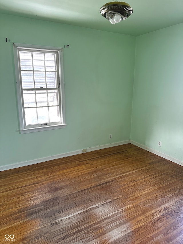 empty room featuring dark wood-type flooring