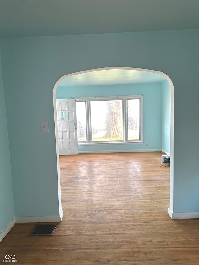 empty room with light hardwood / wood-style floors