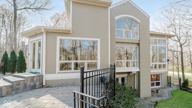 rear view of property featuring a patio