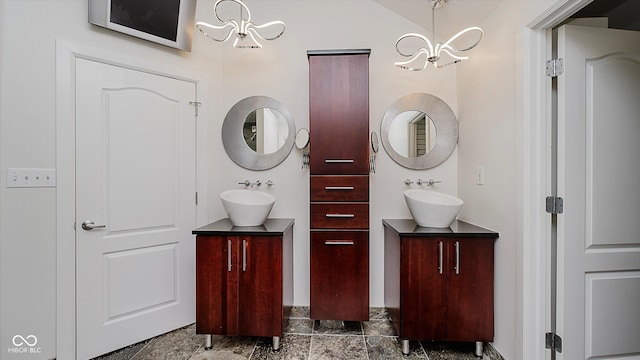 bathroom featuring vanity and an inviting chandelier