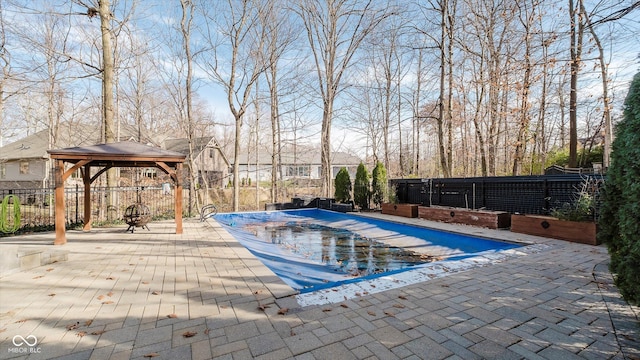 view of pool featuring a gazebo and a patio area