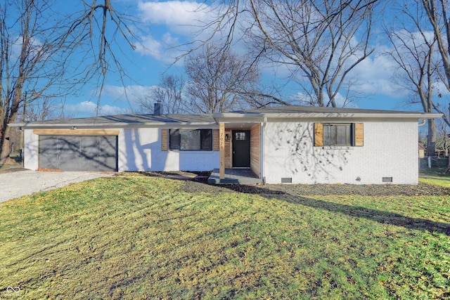 single story home with a front yard and a garage