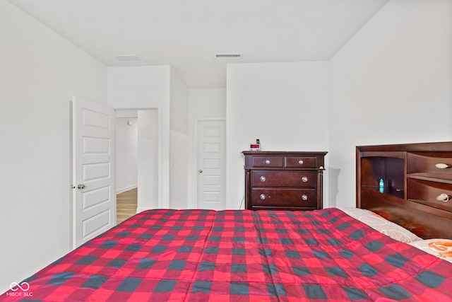 bedroom with hardwood / wood-style floors