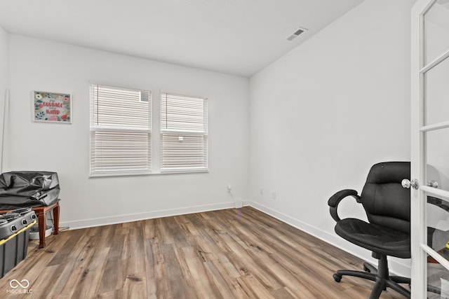 office with hardwood / wood-style floors