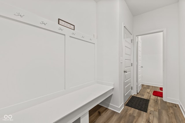 mudroom with wood-type flooring