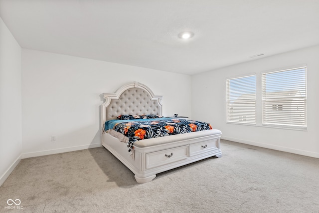 bedroom with light carpet