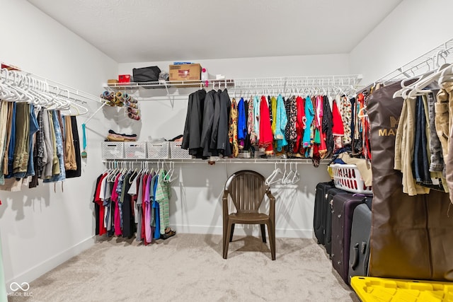 walk in closet featuring carpet