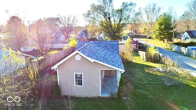 view of outbuilding with a lawn